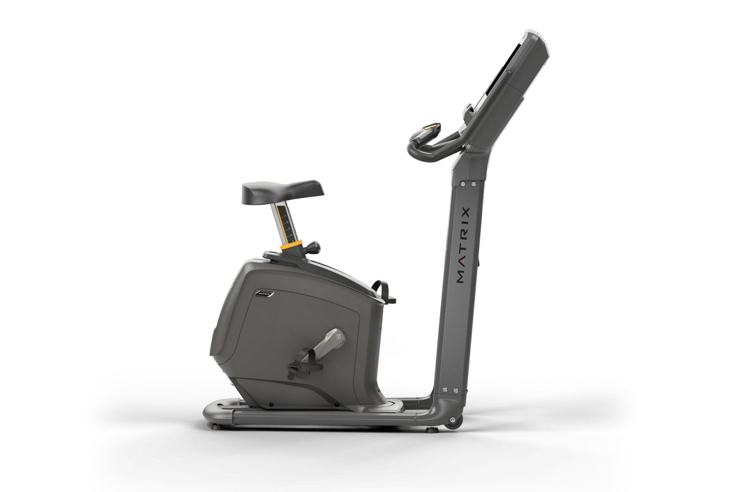Matrix Lifestyle upright exercise bike with black frame, padded seat, handlebar display, and gold accents on white background