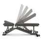 Matrix multi-adjustable weight bench with black frame and gray padded seat, backrest angled upright, shown on white backgroun