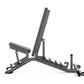 Matrix multi-adjustable weight bench with dark gray frame, padded seat and backrest, adjustable incline position, and leg ext