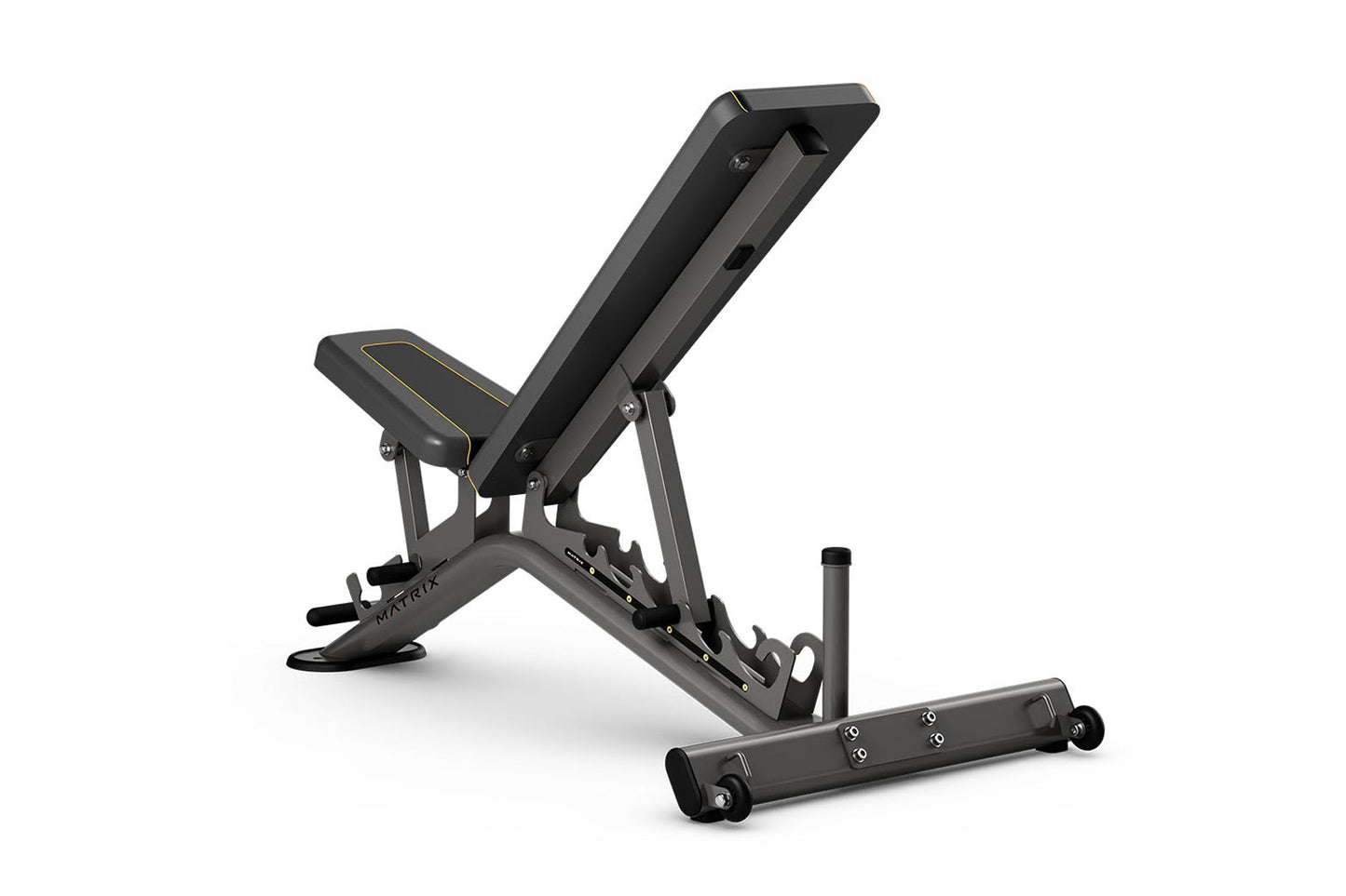 Matrix multi-adjustable weight bench with black padding and gray frame, incline backrest, and leg extension attachment on whi