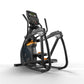 Black and orange elliptical trainer with digital display console, foot pedals, and dual handlebar arms on white background
