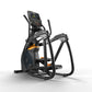 Black and orange elliptical trainer with digital display console, foot pedals, and handlebar arms on white background