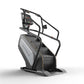Matrix Performance ClimbMill with black frame, gray accent panel, digital console, and black handrails on white background