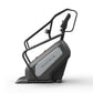 Matrix Performance ClimbMill with black frame, gray console, and dual handles on white background