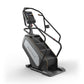 Matrix Performance ClimbMill stair climbing machine with digital display console, black frame, and gray accents on white back