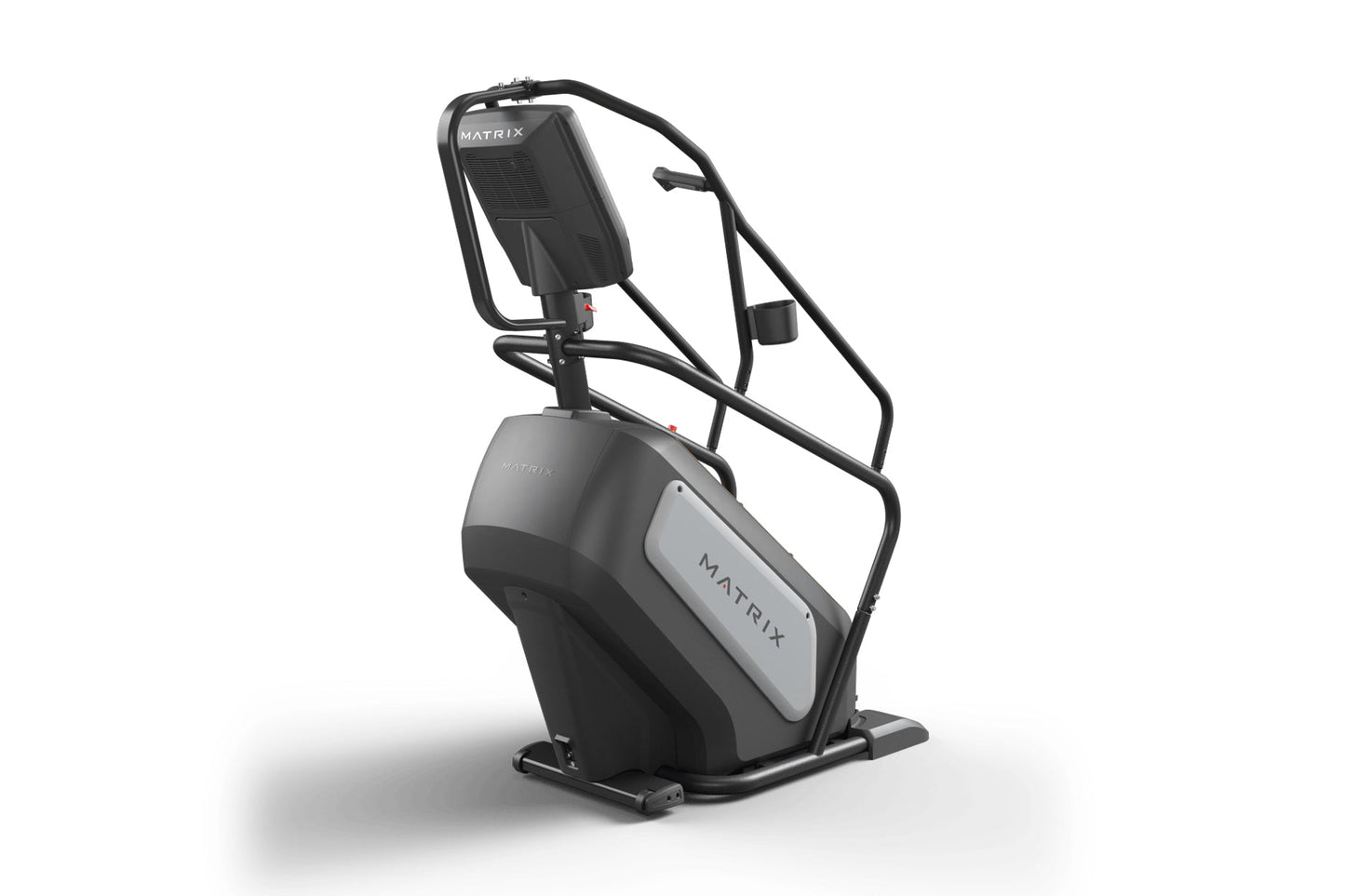 Black and gray Matrix ClimbMill stair climbing exercise machine with handrails and digital display on white background