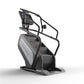 Matrix Performance ClimbMill stair climbing machine with black frame, gray accent panel, digital display console, and handleb