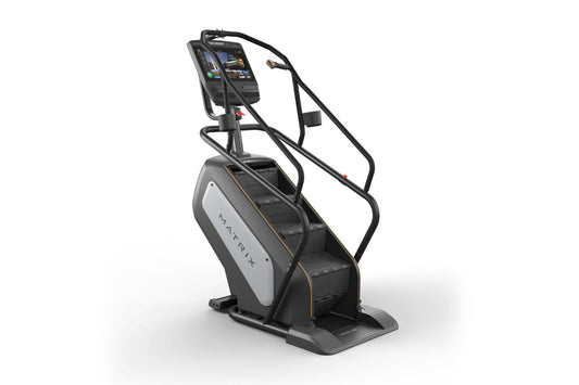 Matrix Performance ClimbMill with black frame, white side panel, digital touchscreen display, and dual handrails on white bac