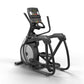 Black and gray elliptical machine with digital console display, dual handles, and foot pedals on white background
