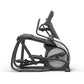Black and gray elliptical machine with gray accents, adjustable arms, and foot pedals on white background