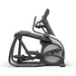 Matrix Performance Suspension Elliptical with black frame, gray flywheel, and curved handlebars on white background