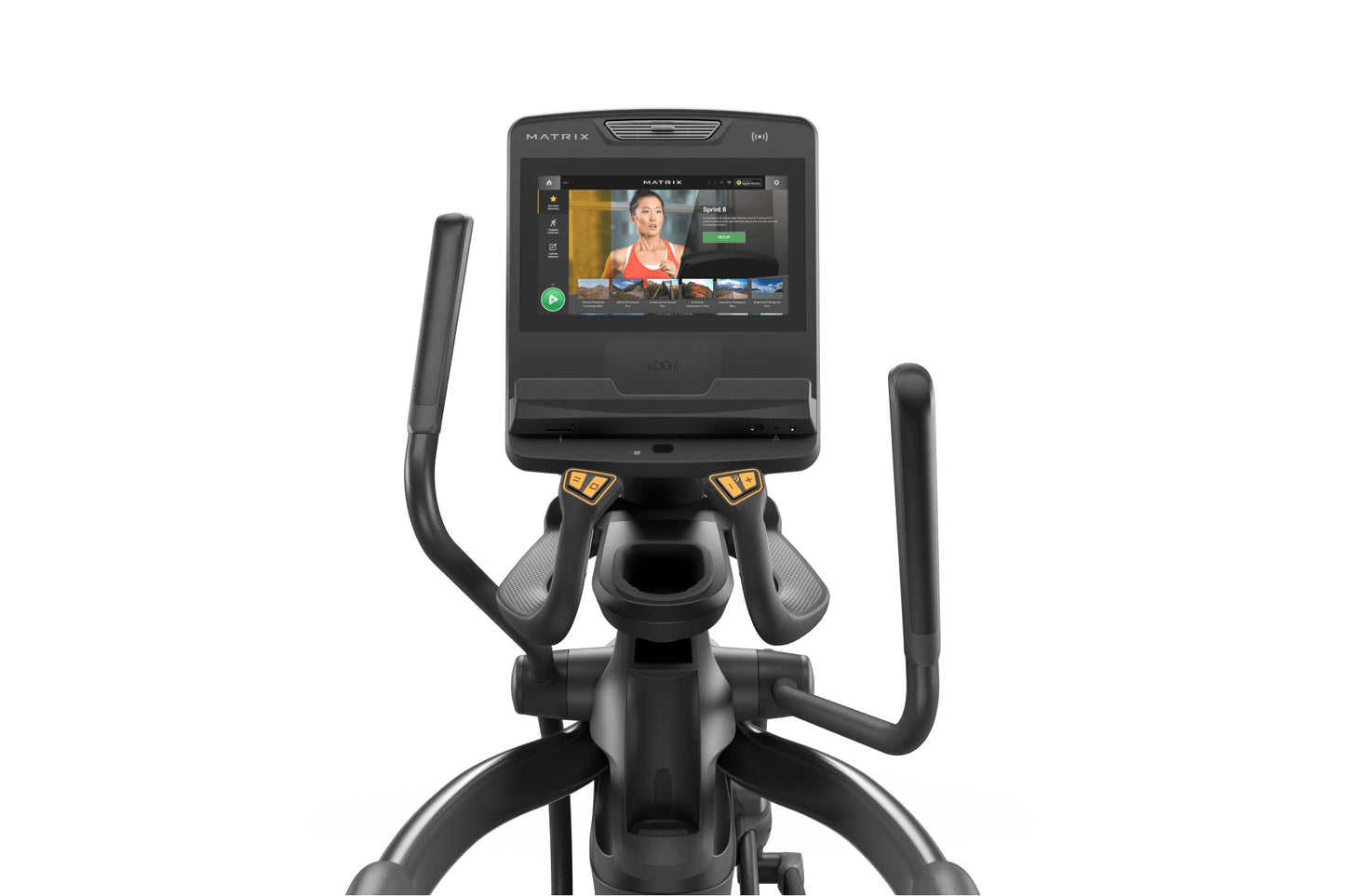 Black Matrix elliptical machine with touchscreen display showing workout video interface, dual handles with yellow grips, and