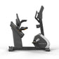 Matrix Performance Hybrid Cycle upright exercise bike with gray and black frame, adjustable seat and handlebars, on white bac