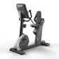 Matrix Performance Hybrid Cycle stationary exercise bike with gray and black frame, digital display console, and padded seat 