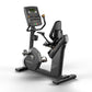 Matrix Performance Hybrid Cycle stationary exercise bike with digital console displaying metrics, black frame and seat, on wh