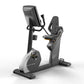 Matrix Performance Hybrid upright exercise bike with black and gray frame, digital console display, and padded seat on white 