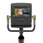 Matrix Performance Hybrid Cycle with touchscreen display showing fitness class, dual yellow and gray handlebar controls, and 