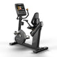 Matrix Performance Hybrid Cycle upright exercise bike with digital display screen and black padded seat on white background
