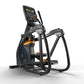Black and orange elliptical trainer with digital display console, foot pedals, and handlebars on white background