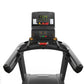 Matrix Performance Plus Treadmill with digital display showing time and metrics, black frame with gray handles, on white back