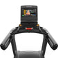 Matrix Performance Plus treadmill with black frame, integrated touchscreen display showing fitness interface, and yellow acce