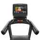Matrix Performance Plus treadmill with black frame, dual handlebar grips, and touchscreen console displaying fitness content 