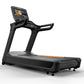 Black commercial treadmill with digital touchscreen display, gray running deck with orange accent stripe, and black handles o