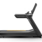 Matrix Performance Plus treadmill with black frame, digital console, and yellow accent stripe on running deck, side view on w