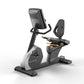 Matrix Performance Recumbent Cycle with black and gray frame, digital console, padded seat, and foot pedals on white backgrou