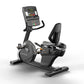 Matrix Performance Recumbent Cycle with black frame, digital console displaying time, and black seat on white background