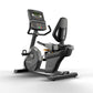 Matrix Performance Recumbent Cycle with black frame, digital display console showing metrics, and ergonomic seat on white bac