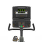 Matrix stationary recumbent exercise bike with black frame, green LED display showing 20.59, digital console with numeric key
