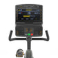 Matrix recumbent exercise bike with digital display showing sprint workout data, black frame with gray seat and black handleb