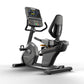 Matrix Performance Recumbent Cycle with digital display console, black frame, padded seat, and foot pedals on white backgroun