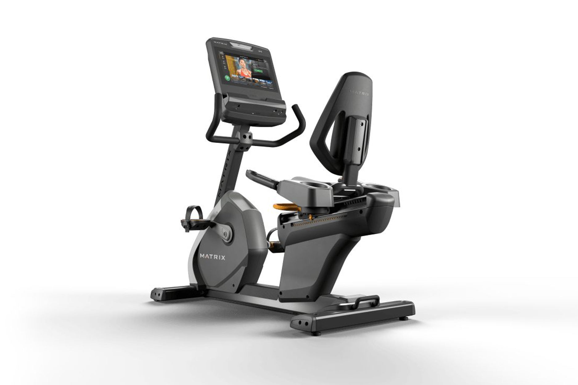 Matrix black and gray recumbent exercise bike with digital touchscreen display and padded seat on white background