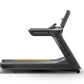 Matrix Performance Treadmill with black frame, gray accents, and gold stripe detail, side view on white background