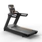 Black Matrix performance treadmill with digital console display, cushioned running deck with yellow accent stripe, and dual h