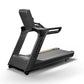 Matrix Performance Treadmill with black frame, gray running deck with yellow accent stripe, and padded black seat backrest on