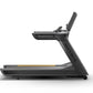 Matrix Performance Treadmill with dark gray frame, digital console, and yellow accent stripe on running deck, shown from side