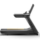 Matrix Performance Treadmill with black frame, digital console, and yellow accent stripe on running deck, side view on white 