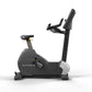 Matrix Performance Upright Cycle stationary exercise bike with black frame, padded seat, handlebars, and display console on w