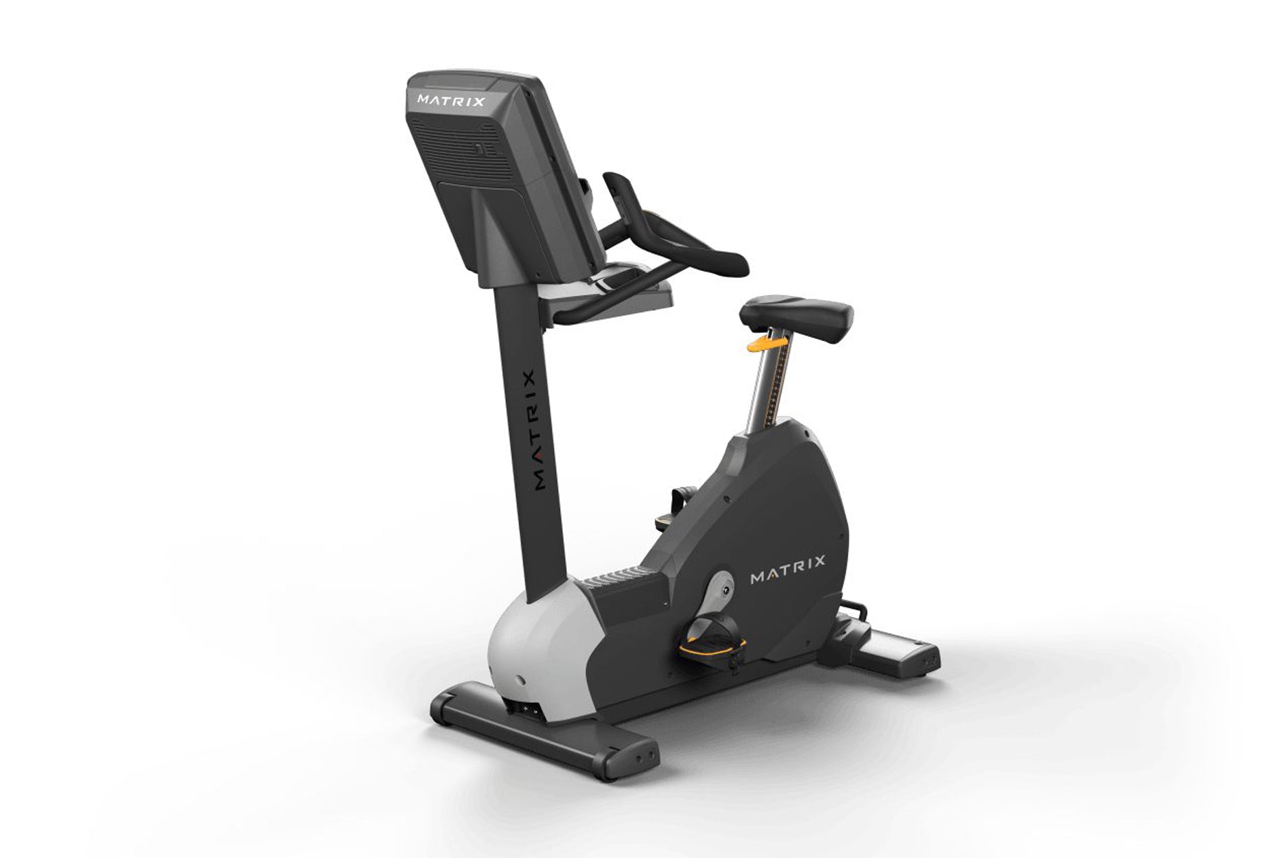 Matrix black and white upright exercise bike with digital display, pedals, and adjustable seat on white background