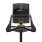 Matrix Performance Upright Cycle with black frame, dual handles with gold accents, and digital display console showing sprint
