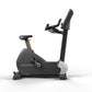 Matrix Performance Upright Cycle with black frame, gray base, adjustable handlebars, and padded seat on white background