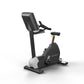 Matrix black and white upright stationary exercise bike with digital console on white background