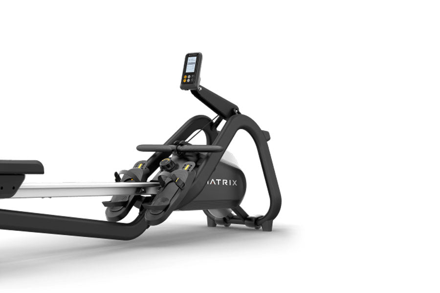 Matrix rowing machine with black frame, digital display console, and silver rail on white background
