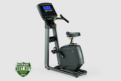 Matrix U50 upright exercise bike with black seat, gray frame, digital display console, and hand grips on white background