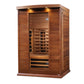 Cedar wood infrared sauna cabin with glass door, interior bench seating, infrared heaters, and overhead lighting on white bac