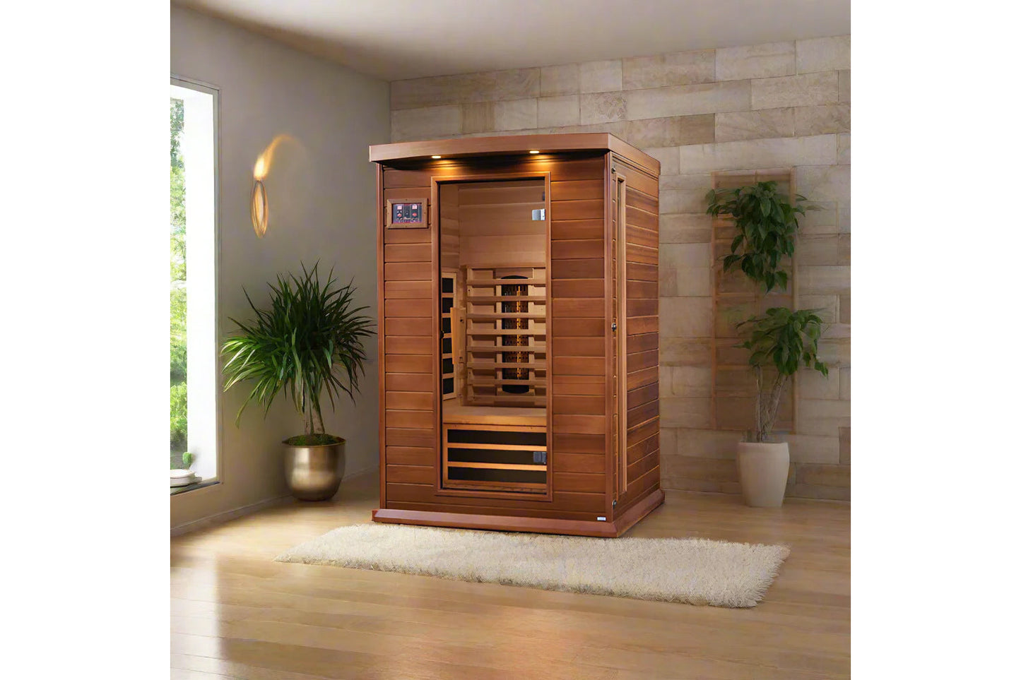 Two-person infrared sauna with cedar wood construction, glass door, and digital control panel in modern spa room with potted 