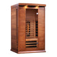 Red cedar two-person infrared sauna with glass front door, wooden benches, and overhead LED lighting on white background